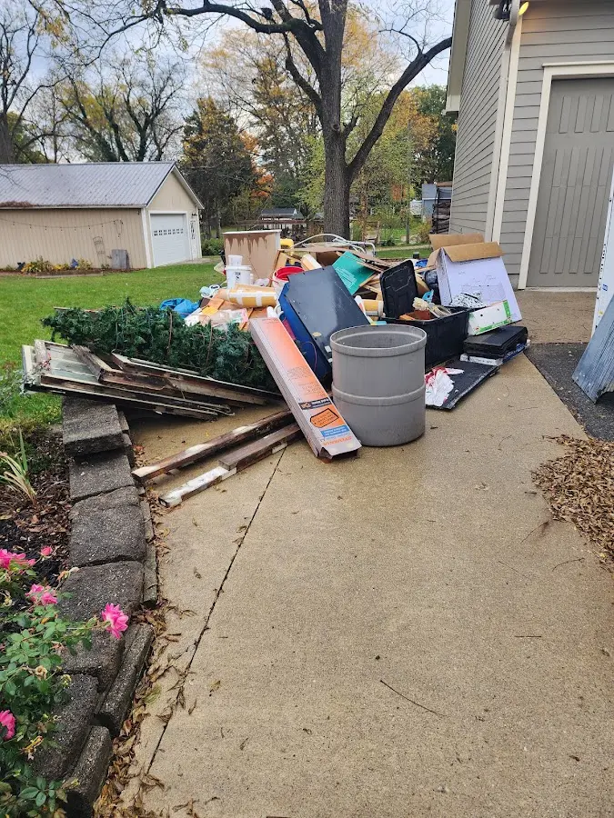Dumpster being loaded with debris for 10 Yard Dumpster Rental in Montgomery